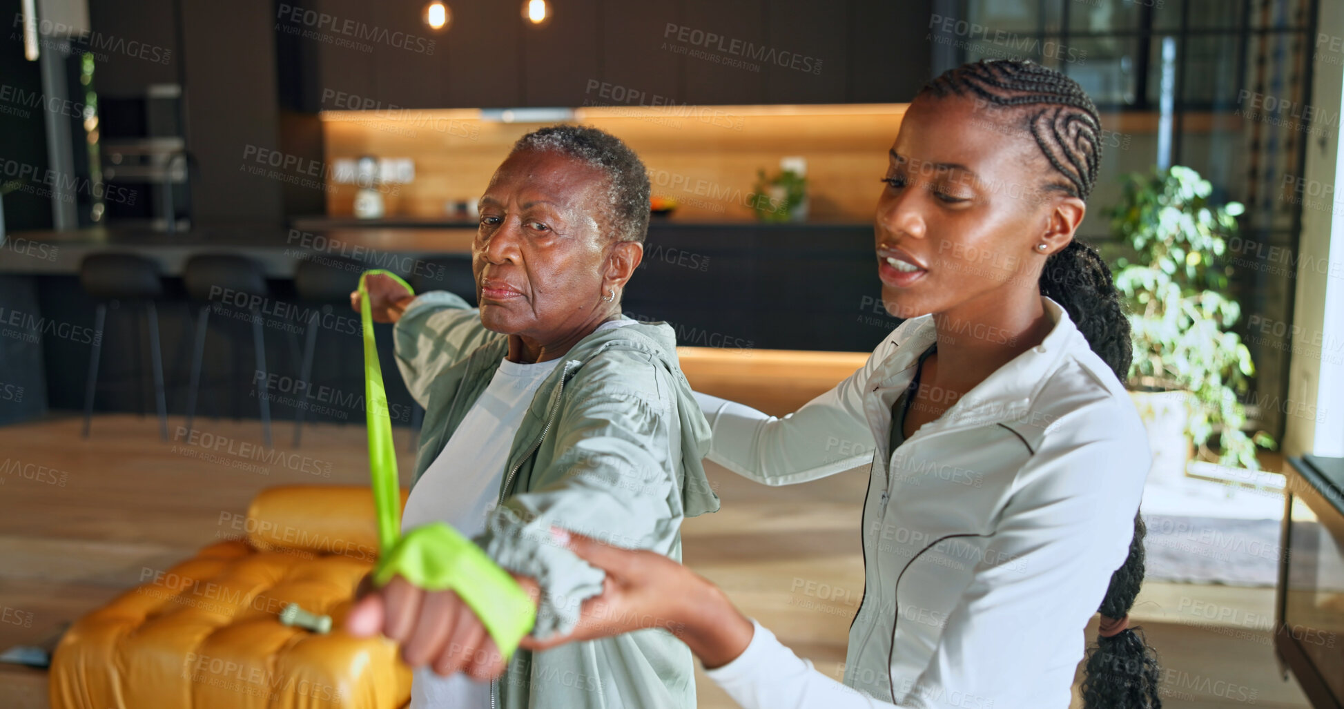 Buy stock photo Personal trainer, resistance bands and fitness with black women in home for help, geriatric health and support. Physical therapy, rehabilitation and wellness with senior person for low impact workout