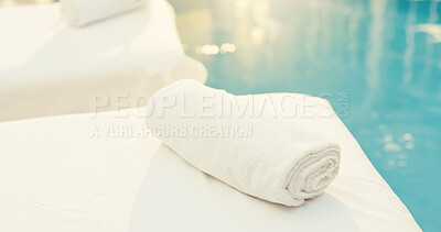 Buy stock photo Spa, empty and towel on bed at resort for pamper, beauty treatment and calm for wellness retreat. Hospitality, background and massage table for stress relief, holistic therapy and skincare by pool