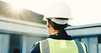 Construction, thinking or woman outdoor with back, progress track or mindset in building remodeling. Flare, space or supervisor with review, project reflection or operation plan on renovation site.