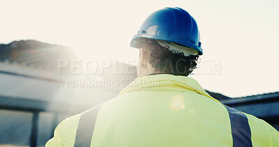 Buy stock photo Construction, thinking and man on site with inspection, progress track and perspective on remodeling. Flare, space and engineer with back, project reflection and operation plan on renovation.