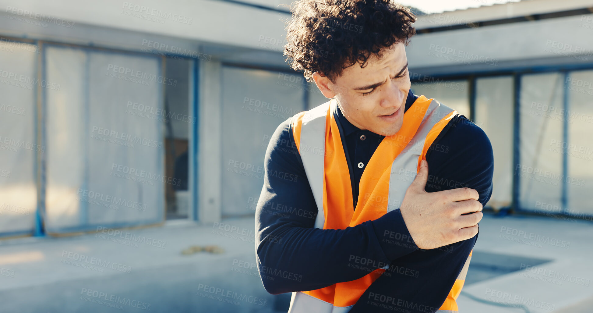Buy stock photo Man, architect or arm pain with injury on construction site for building accident, fall or stress. Frustrated, male person or contractor with sore discomfort for muscle tension, emergency or mistake