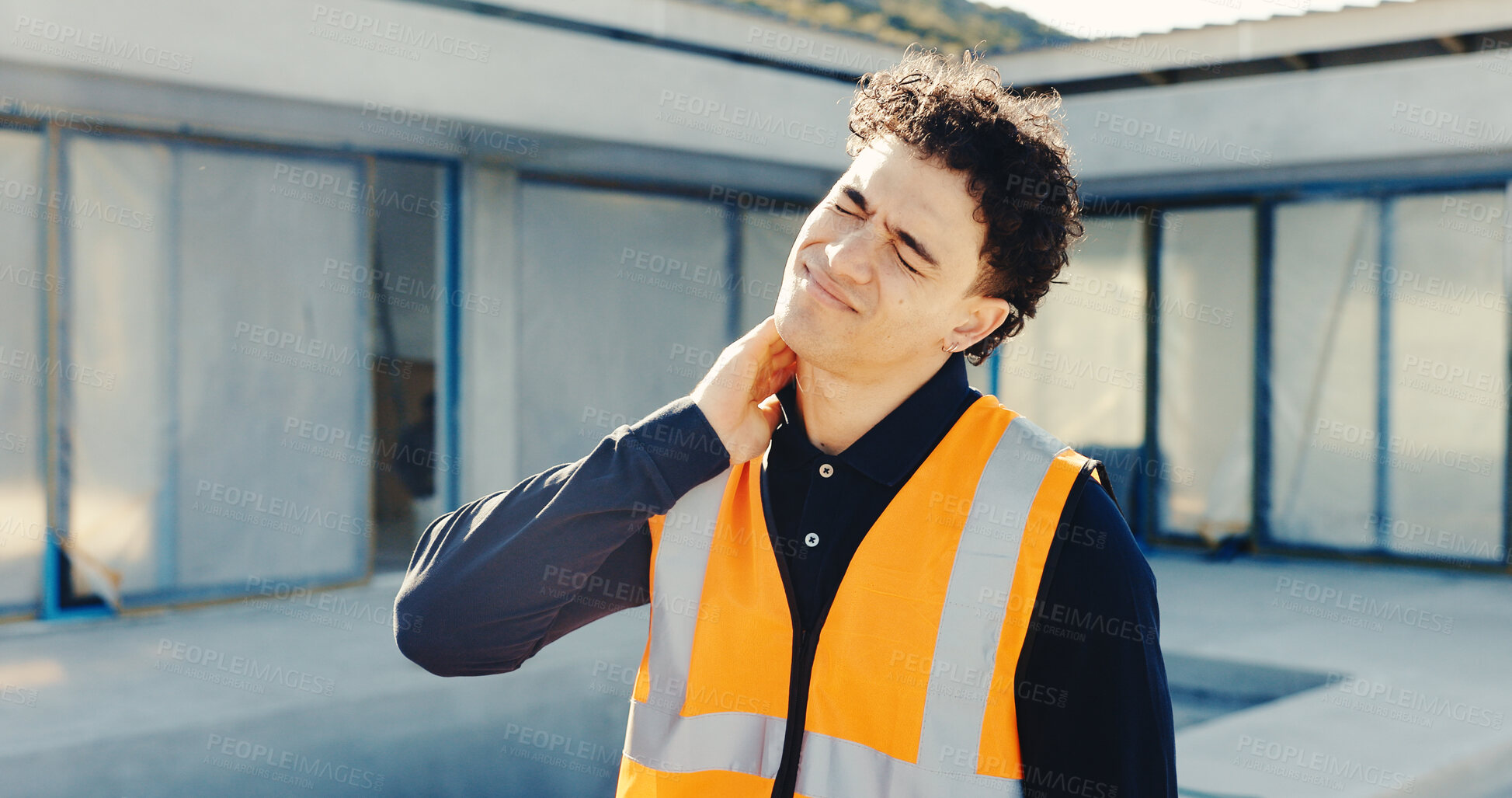 Buy stock photo Man, architect or neck pain with injury on construction site for building accident, fall or stress. Frustrated, male person or contractor with sore discomfort for muscle tension, emergency or mistake