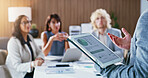 Tablet screen, graph and man with business people, meeting and financial review for budget proposal. Office, team and workers on tech with chart for investment planning, finance report and feedback