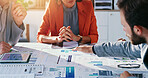 Team, hands and meeting with documents for analytics, performance review or revenue strategy. Group, people or employee pointing with paperwork graph or chart for company profit, increase or progress