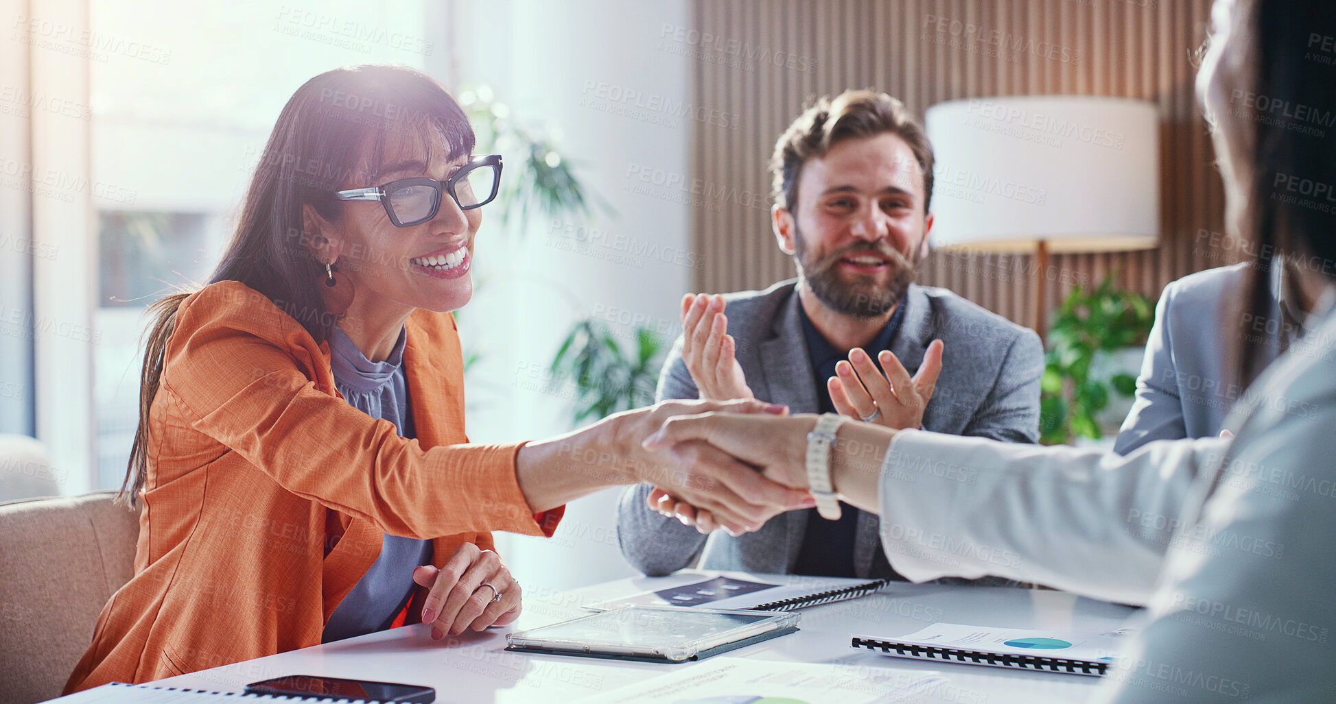 Buy stock photo Excited, meeting and business people with handshake in office for hiring, onboarding or agreement. Happy, group or employees shaking hands with smile for recruitment process, success or opportunity