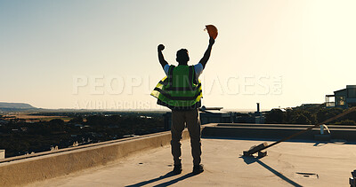 Buy stock photo Back, engineer and fist pump at site for construction, good news and foundation success of project. Space, man or raised hands on rooftop for celebration, pass inspection and architecture achievement