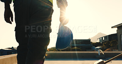 Buy stock photo Hand, helmet and construction worker on rooftop for safety compliance, building development or walk. Flare, space and electrician outdoor for home renovation, engineering and maintenance at property