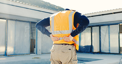 Buy stock photo Architect, man and back pain with injury on construction site for building accident, fall or mistake. Male person, contractor or civil engineer with sore spine or discomfort for safety emergency