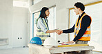 Architect, technician and meeting with handshake on construction site for building partnership. Man, woman or contractor shaking hands with team agreement for architecture project or deal together