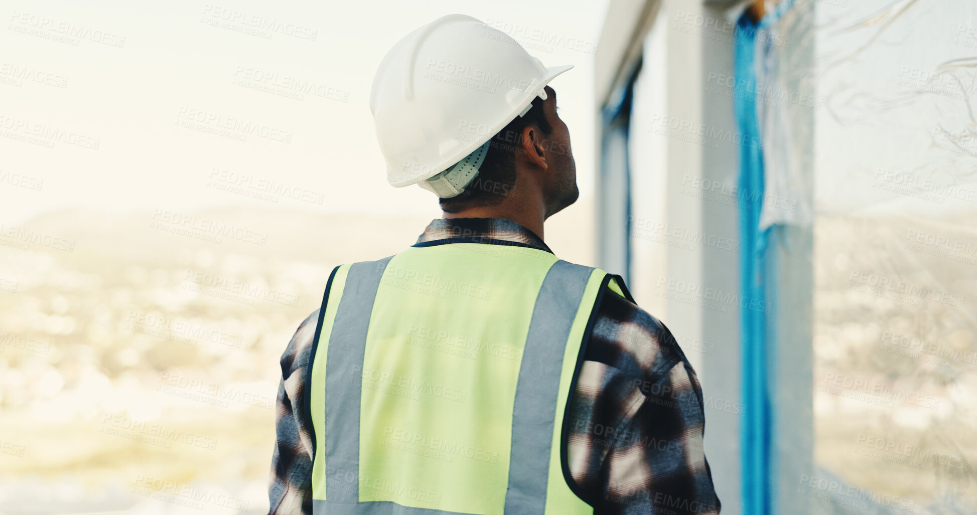 Buy stock photo Architect, man and inspection on construction site for renovation, building or safety regulations. Male person, back and civil engineer with check for infrastructure, architecture project or security