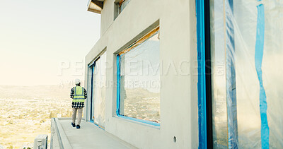 Buy stock photo Architect, man and walk on construction site for inspection, building or safety regulations. Male person, back and civil engineer with check for infrastructure, architecture project or security