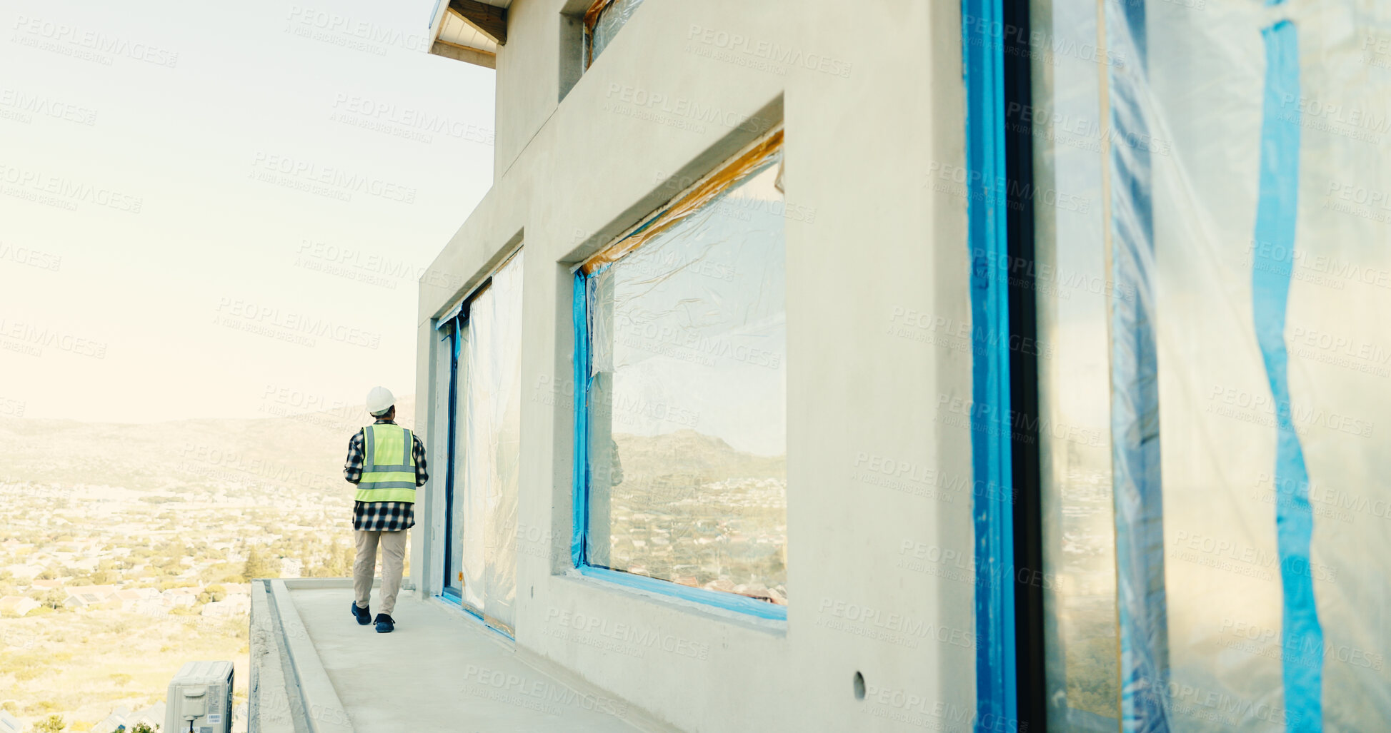 Buy stock photo Architect, man and walk on construction site for inspection, building or safety regulations. Male person, back and civil engineer with check for infrastructure, architecture project or security
