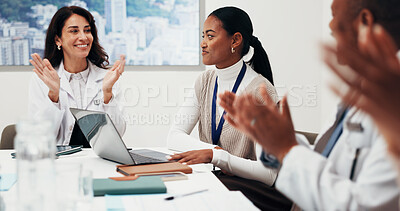 Buy stock photo Clapping, woman and celebration with doctors in meeting for medical support, success or praise. Smile, people and healthcare team applause, employee recognition and thank you in office with laptop