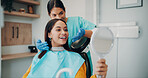 Women, dentist and mirror with patient for smile, oral care or treatment options in clinic. Hygiene, support and people with consultation for root canal, dental surgery or tooth whitening in office
