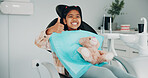 Child, dentist and thumbs up with teddy bear in clinic for dental surgery, operation or treatment. Portrait, kid or girl with smile, like emoji or stuffed animal for oral hygiene, service or success
