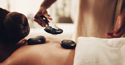 Buy stock photo Spa, hot stones and people with back massage, deep tissue treatment and healing for stress relief. Hospitality, resort and woman with therapeutic skincare for pamper, self care and relax with heat