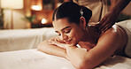 Relax, woman and happy at spa with back massage, muscle tension and deep tissue with essential oil. Calm client, beauty therapist or pressure technique for body pamper, healing therapy or pain relief
