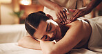 Relax, woman and smile at spa with back massage, muscle tension and deep tissue with essential oil. Calm client, beauty therapist or pressure technique for body pamper, healing therapy or pain relief