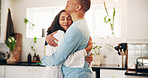 Mature, couple and hug in home with care, bonding together and appreciate relationship with partner. People, embrace and love in kitchen with marriage commitment, relax and connection with spouse.