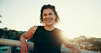 Portrait, happy and woman on bridge for fitness, exercise and workout for wellness in morning. Sports, runner and person in city with smile, break and rest for training, running challenge or hobby