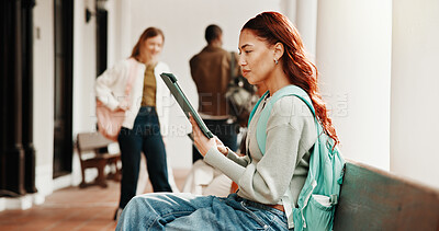 Buy stock photo Student, woman and reading at college with tablet, digital learning platform and ebook for education. Person, browsing and outdoor on campus with tech, app and online textbook for university course.
