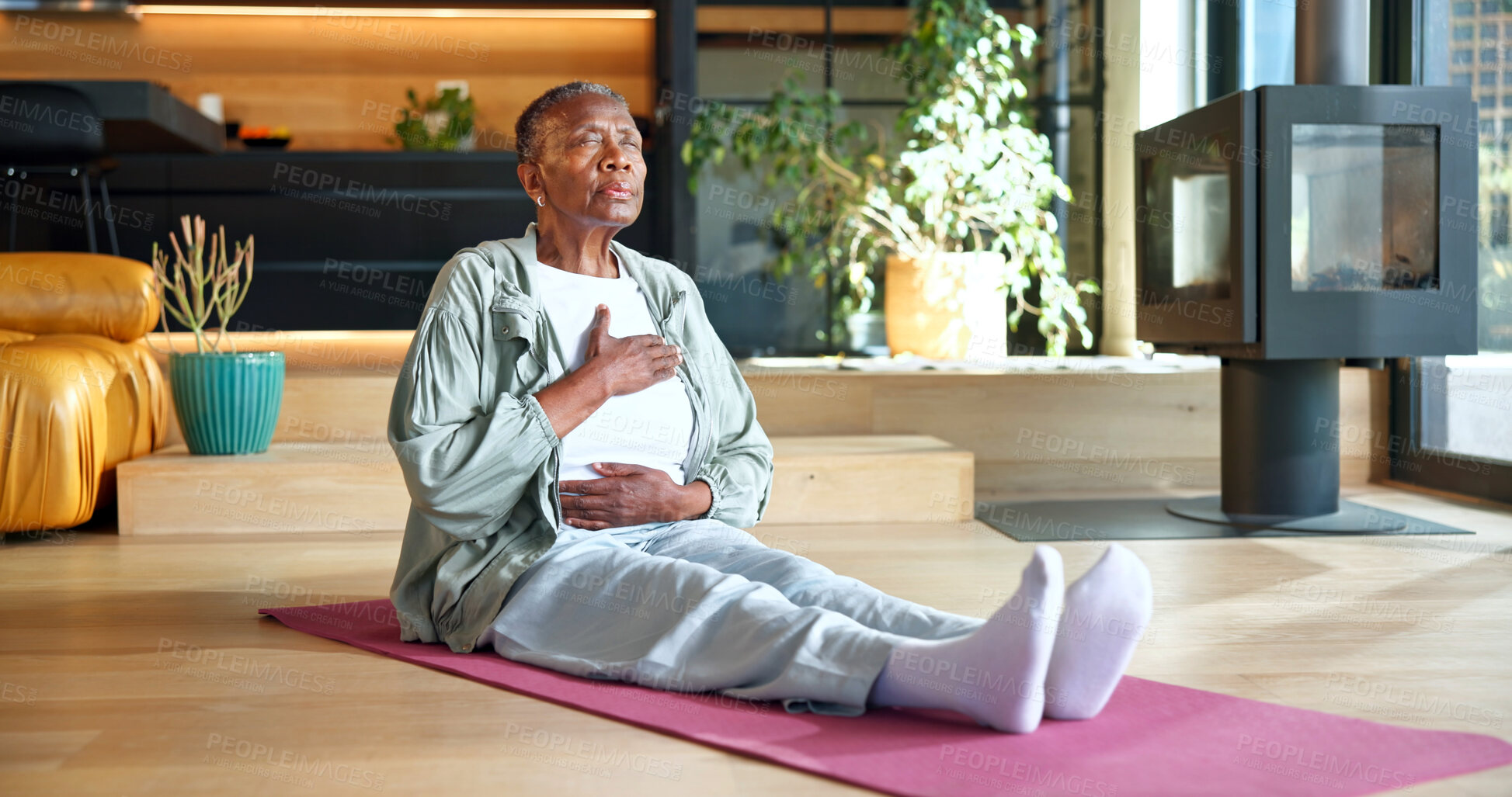 Buy stock photo Black woman, breath and retirement at house for meditation, holistic balance and practice for zen. Senior person, exhale and yoga in lounge with eyes closed, inner peace, and mindfulness for wellness