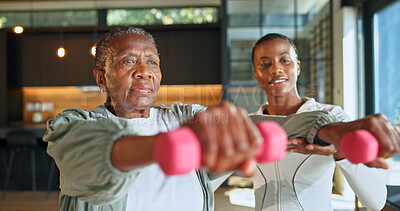 Buy stock photo Personal trainer, weights and fitness with black women in home for help, geriatric health and support. Exercise instructor, wellness and dumbbell with senior person in house for low impact workout