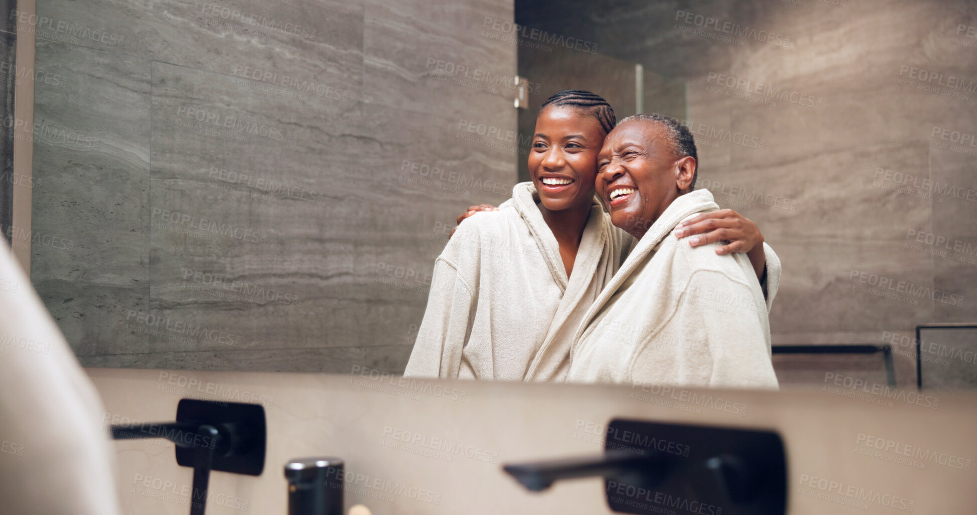 Buy stock photo Bathroom, mirror and woman with senior mom for wellness, skincare and grooming together for bonding. Hug, happy and African daughter, mother and reflection for pamper, self care and beauty in home