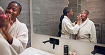 Bathroom, woman and senior mom for eye mask, skincare and treatment together for bonding. Family, mirror and African daughter, mother and cosmetics for skin hydration, self care and beauty in home