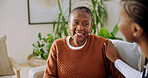 Senior, patient and nurse with support in nursing home, helping hand and health with smile. African woman, caregiver and aid in elderly care, comfort and happy for assisted living and wellness
