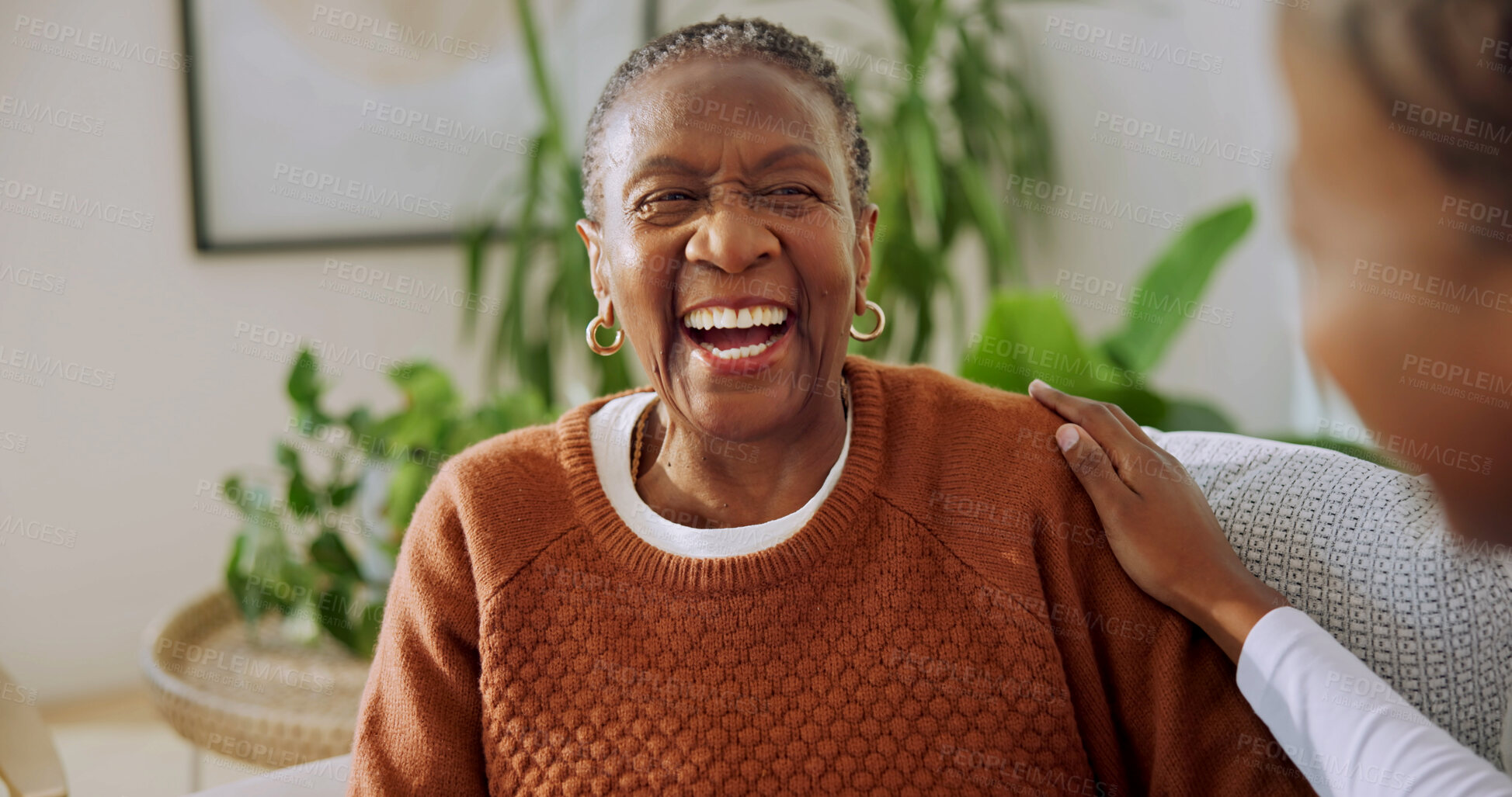Buy stock photo Old woman, nurse and laughing with support in nursing home, helping hand or health in lounge. African patient, caregiver and elderly care with humor together for assisted living and wellness at house