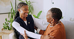 Support, caregiver and old woman on sofa with embrace, understanding and empathy in assisted living. Compassion, nurse and elderly person with hug, happy relationship and trust in retirement home.