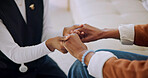 Support, caregiver or old woman on couch with holding hands, security or empathy in assisted living. Compassion, nurse or elderly person with comfort, healthy relationship or trust in retirement home