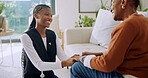 Happy, old woman and holding hands with caregiver in nursing home, connection or gratitude for help. Assisted living, nurse and support for senior black person, healthcare and patient in lounge