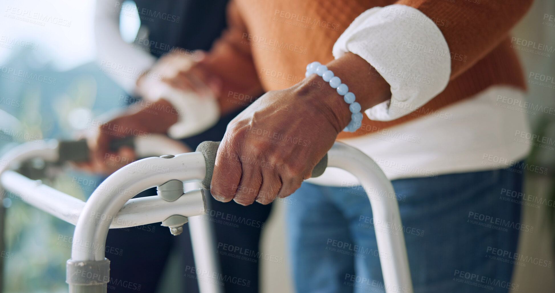 Buy stock photo Caregiver, help and hands with walker in nursing home, rehabilitation or support for senior patient. Homecare, nurse and walking with elderly person, healthcare and assisted mobility for recovery