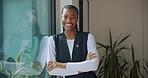 Happy, portrait and caregiver with crossed arms in nursing home for support, career and healthcare. Smile, nurse and black woman with pride for medical service, job and trust at retirement facility