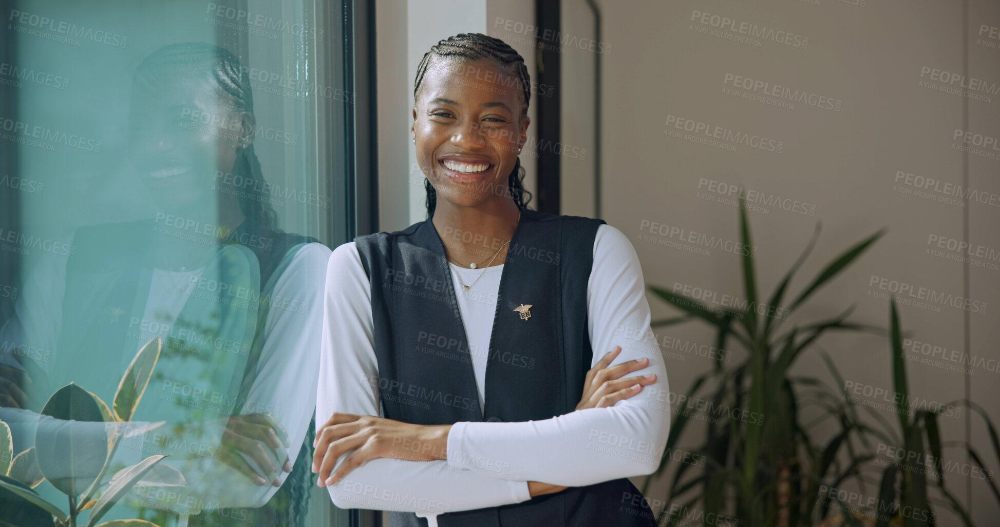 Buy stock photo Happy, portrait and caregiver with crossed arms in nursing home for support, career and healthcare. Smile, nurse and black woman with pride for medical service, job and trust at retirement facility
