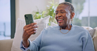 Buy stock photo Video call, online and old woman with phone in lounge, laugh and communication with contact on web. Retirement, home and senior black person with mobile, happiness and virtual chat with social media