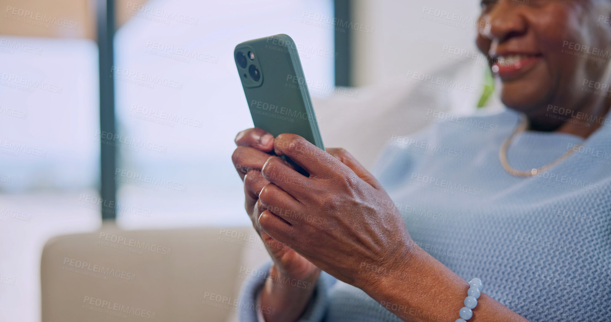 Buy stock photo Hands, texting and smile with phone in home, scroll and communication with contact on social media. Typing, message and senior person with mobile, retirement and happy with chat on website or online