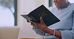 Hands, bible and old woman reading in home with Christian belief, knowledge or worship Jesus Christ. Senior person, holy book and faith in retirement with Catholic religion, spiritual guide or gospel