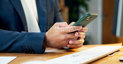 Buy stock photo Connectivity, hands and phone of business man at desk in office for internet search or scrolling. App, communication and networking with employee typing on mobile at work for text message response