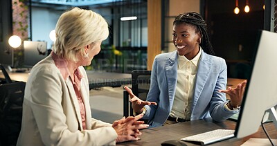 Buy stock photo Collaboration, excited and talking with business women at desk in office for planning or research. Conversation, feedback and smile with happy employee people in corporate workplace for development