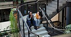 People, comfort or support with colleague on staircase for bad news, job loss or mistake in office. Business, employees or coworking helping friend with empathy for understanding or reassurance