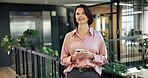 Phone, smile and thinking with business woman in green office for connectivity or networking. App, happy employee and plants in eco friendly workplace for communication or sustianability project