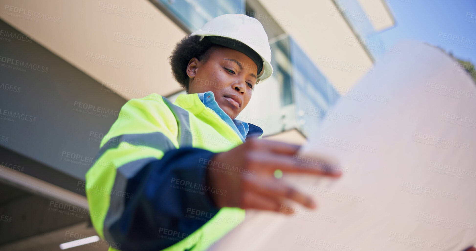 Buy stock photo Engineer, reading and woman with blueprint, outdoor and planning for property development or design. Civil engineering, low angle and black person with paperwork, architecture and renovation project