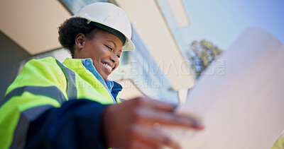 Buy stock photo Engineer, reading and happy woman with blueprint, outdoor and plan for renovation project or design. Civil engineering, low angle and black person with paperwork, real estate and property development