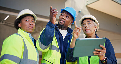 Buy stock photo Engineer, team and plan at construction site with tablet,  discussion or technician with inspection. Supervisor, people and point in building with tech, check engineering and talk with electrician.