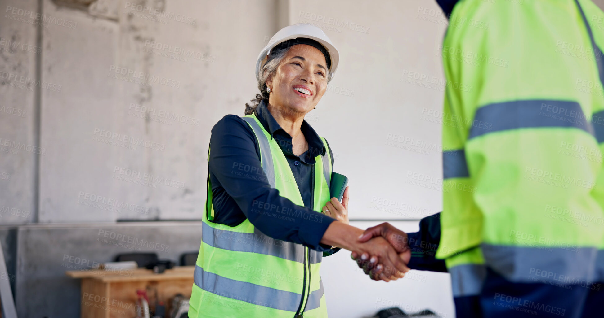 Buy stock photo Woman, smile or handshake at construction site for meeting, development team or introduction. Mature worker, deal or shaking hands at worksite for welcome, engineer collaboration or building feedback