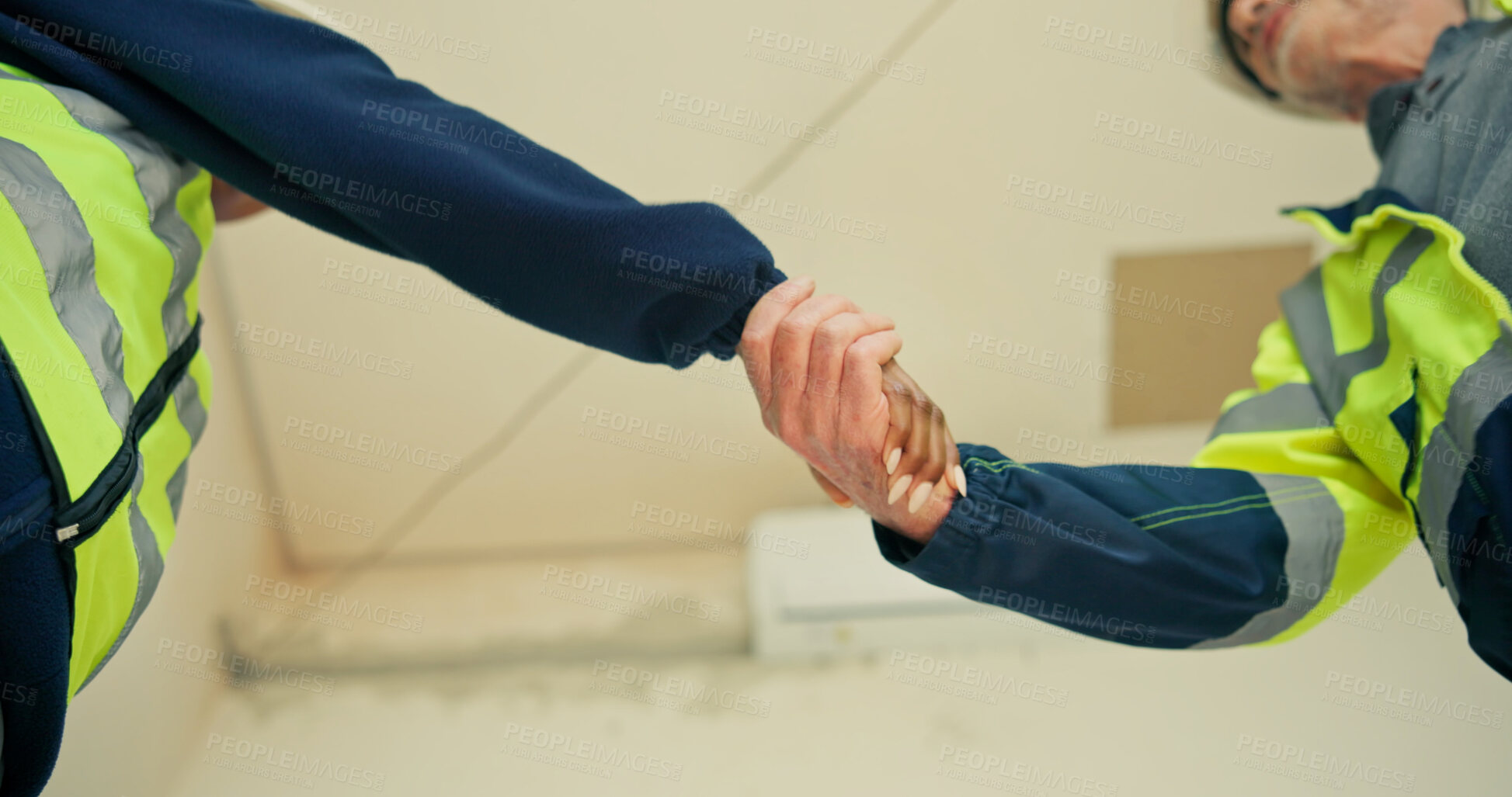Buy stock photo Architect, team and handshake with agreement for partnership, building deal or development together. Low angle, contractor or civil engineer shaking hands for b2b, onboarding or architecture project
