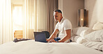 Happy, man and laptop in hotel room for business trip, check schedule or agenda for overseas seminar. Mature person, browse or plan in accommodation with computer, travel and calendar for conference.